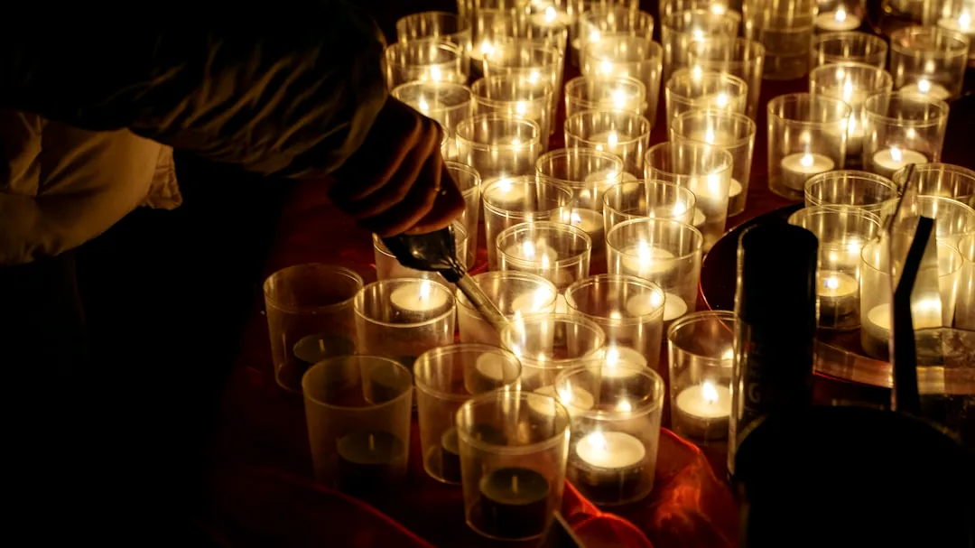 a table topped with lots of lit candles