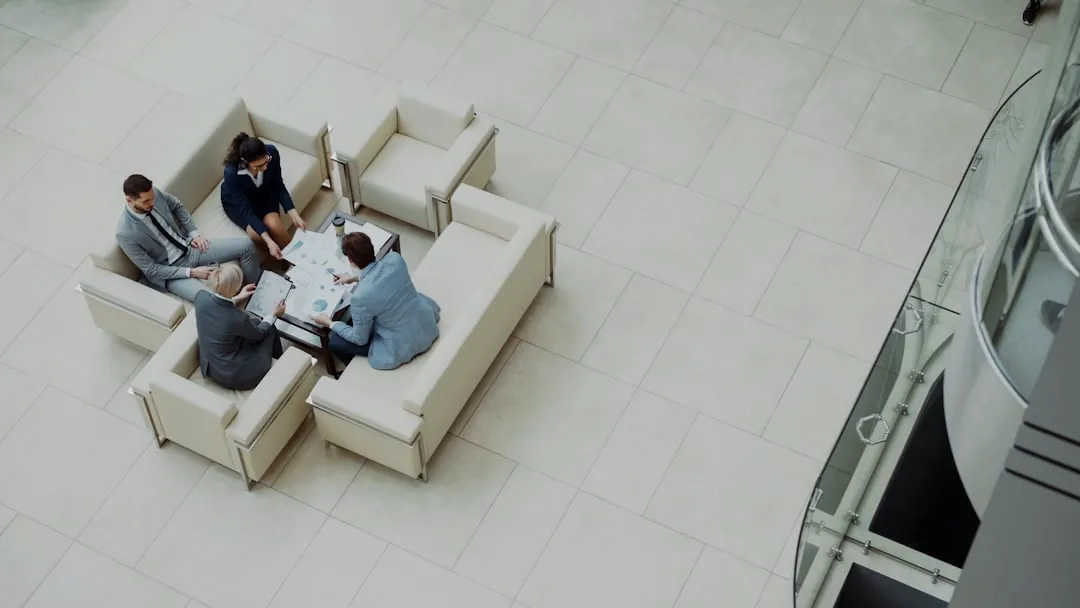 Business meeting around a table on sofas.