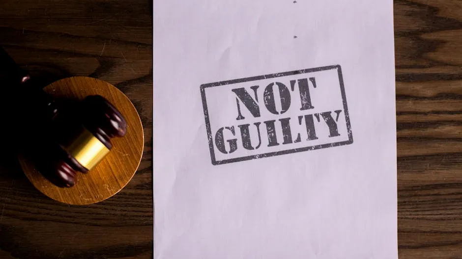 A courtroom document labeled 'Not Guilty' beside a gavel symbolizes justice.