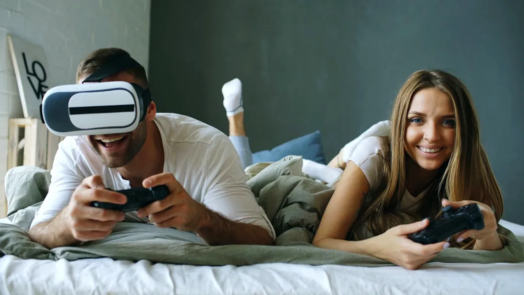 Couple playing video games with vr headset