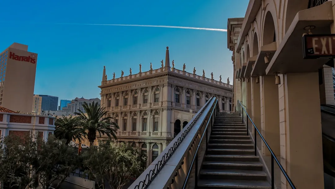 Grand building with ornate details under clear blue sky