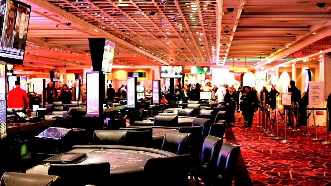 People walking through a busy casino gaming floor