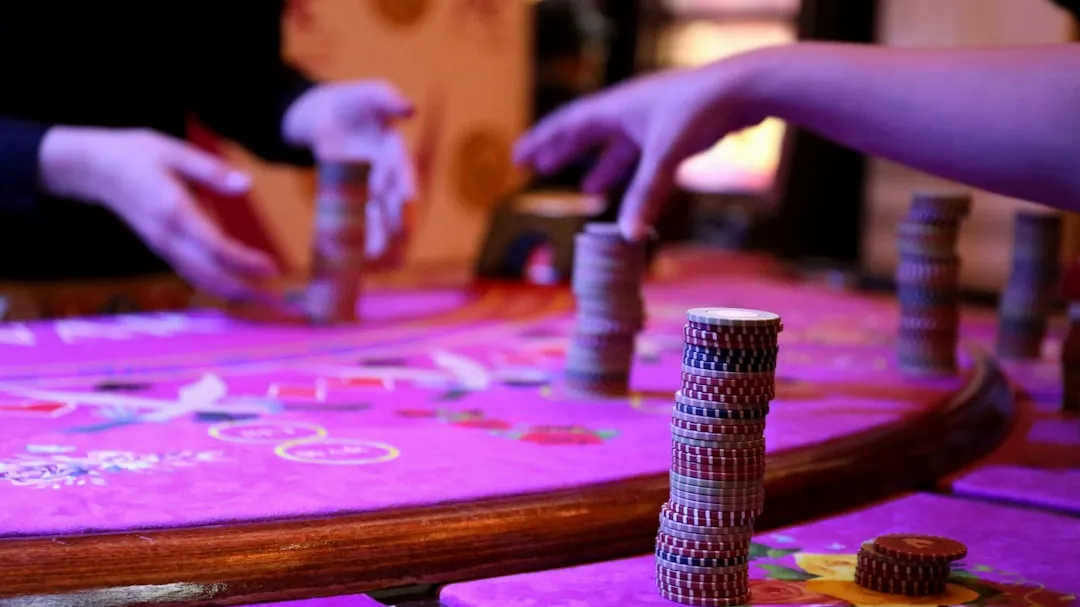 silver and black tube on pink and purple table cloth
