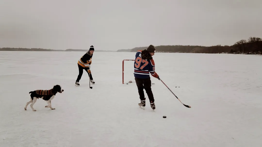 two men playing ice hockey game