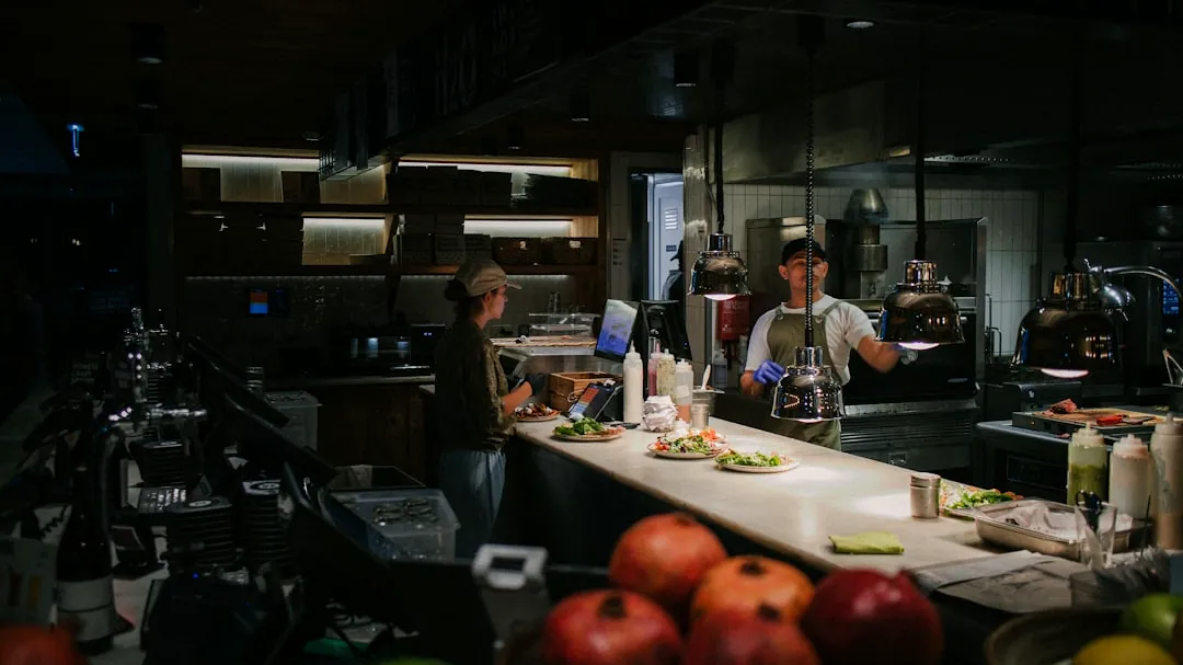 a couple of men in a kitchen