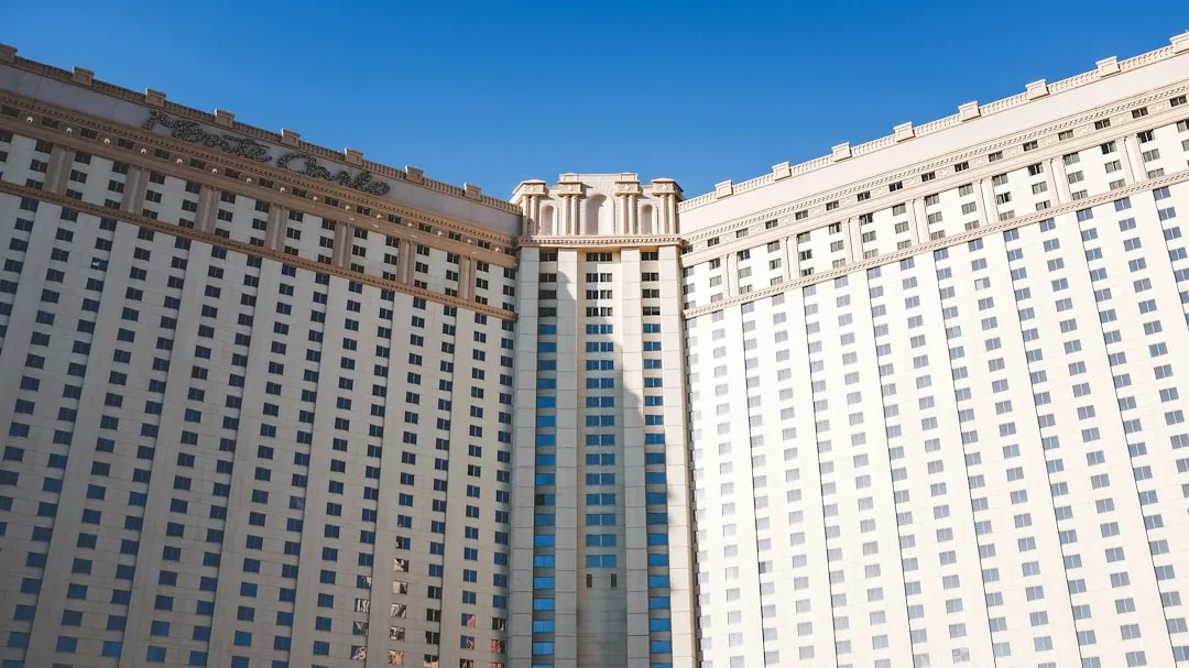 a couple of tall buildings sitting next to each other