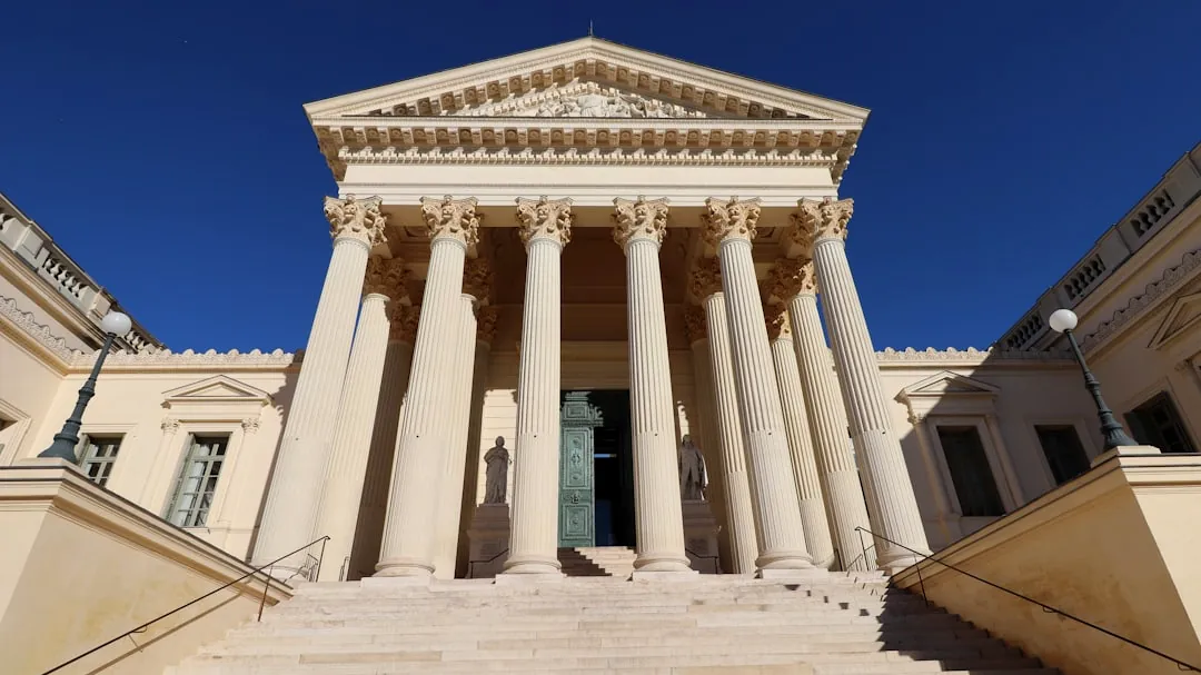 a large building with columns and a door