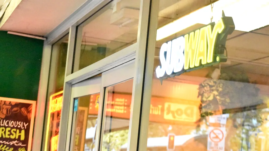 Subway restaurant exterior with illuminated sign
