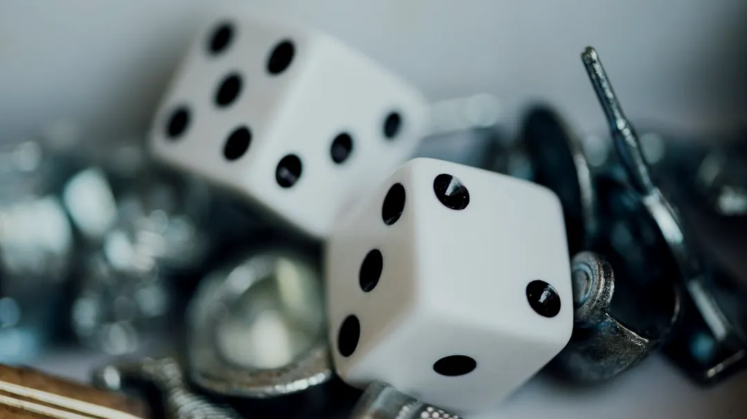 white dice on black metal rack