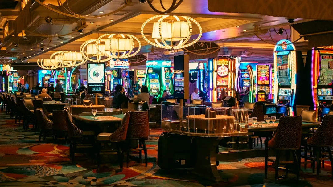 A casino interior with slots and tables is shown.