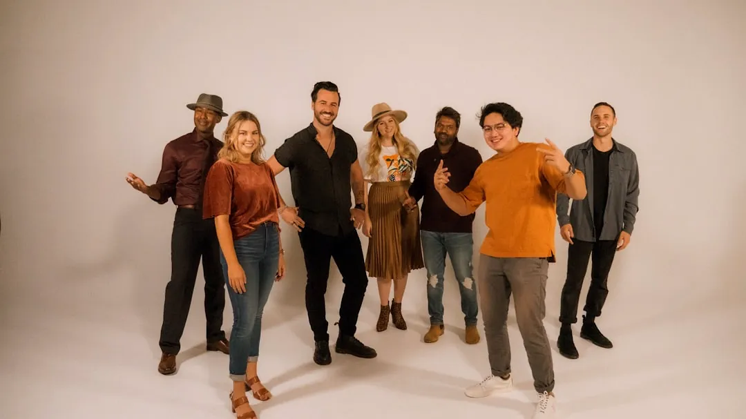 group of people standing on white floor