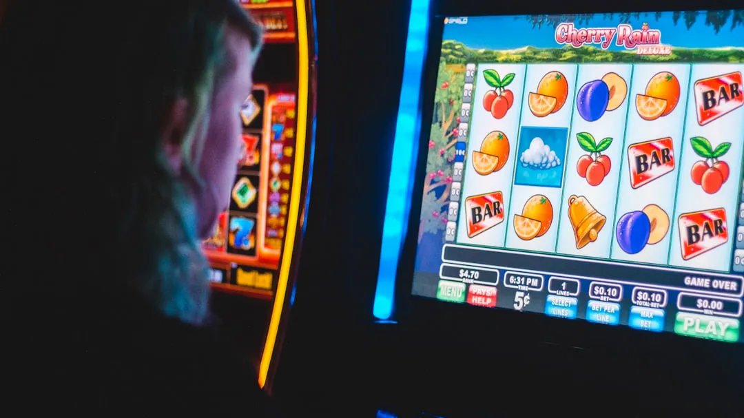 man playing slot machine game