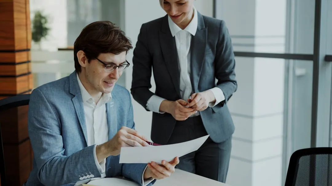 Two business people reviewing documents together